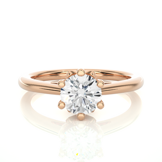 Front view of 1.50 Ct Round Moissanite Solitaire Engagement Ring In Rose Gold, highlighting the brilliant center moissanite stone.