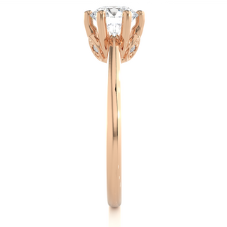 Side profile of 1.50 Ct Round Moissanite Solitaire Engagement Ring In Rose Gold, highlighting the prong setting.