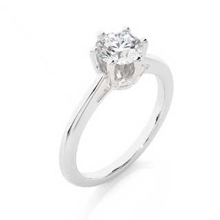 Angled view of 1.50 Ct Round Moissanite Solitaire Engagement Ring In White Gold, showcasing the band and setting.​