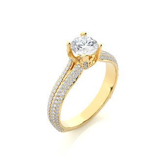 Angled view of 1.50 Ct Round Moissanite Split Shank Engagement Ring In Yellow Gold, showcasing the band and setting.​