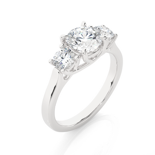 Angled view of 1.50 Ct Round Moissanite Three Stone Engagement Ring In Silver, showcasing the band and setting.​