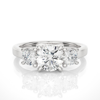 Front view of 1.50 Ct Round Moissanite Three Stone Engagement Ring In Silver, highlighting the brilliant center Moissanite stone.