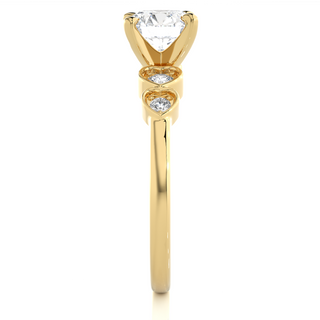 Side profile of Front view of 1.50 Ct Round cut Moissanite Five Stone Engagement Ring In Yellow Gold, highlighting the brilliant center moissanite stone., highlighting the prong setting.