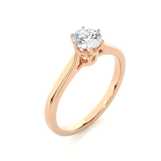 Angled view of 1 Carat Round Moissanite Solitaire Engagement Ring In Rose Gold, showcasing the band and setting.​