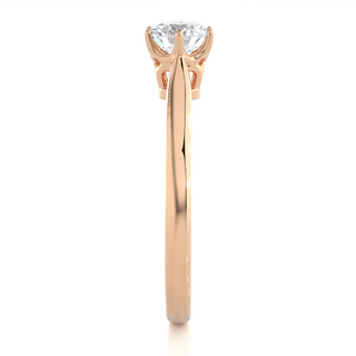 Side profile of 1 Carat Round Moissanite Solitaire Engagement Ring In Rose Gold, highlighting the prong setting.