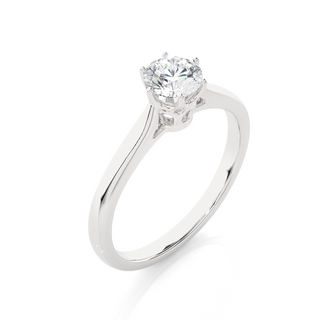 Angled view of 1 Carat Round Moissanite Solitaire Engagement Ring In Silver, showcasing the band and setting.​