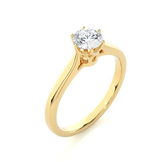Angled view of 1 Carat Round Moissanite Solitaire Engagement Ring In Yellow Gold, showcasing the band and setting.​