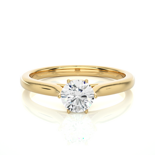 Front view of 1 Carat Round Moissanite Solitaire Engagement Ring In Yellow Gold, highlighting the brilliant center moissanite stone.