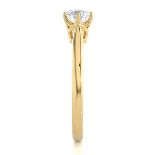 Side profile of 1 Carat Round Moissanite Solitaire Engagement Ring In Yellow Gold, highlighting the prong setting.