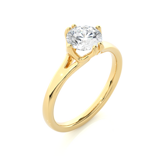 Angled view of 1 Carat Round Moissanite Split Shank Solitaire Engagement Ring In Yellow Gold, showcasing the band and setting.​