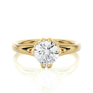 Front view of 1 Carat Round Moissanite Split Shank Solitaire Engagement Ring In Yellow Gold, highlighting the brilliant center moissanite stone.