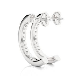 angled view of 1ct round moissanite c hoop earrings in silver with bright sparkle in channel setting.