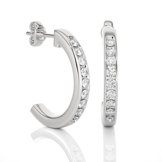 side view of 1ct round moissanite c hoop earrings in silver with bend and some stones showing.