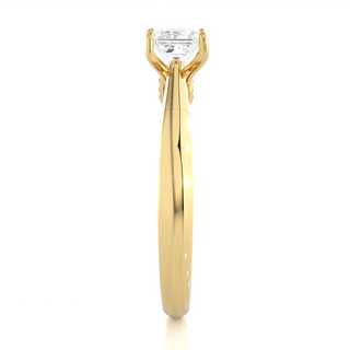 Side profile of 1 Ct Princess Moissanite Solitaire Engagement Ring In Yellow Gold, highlighting the prong setting.
