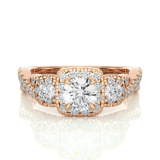 Front view of 2.50 Ct Round Moissanite Three Stone Halo Engagement Ring In Rose Gold, highlighting the brilliant center Moissanite stone.