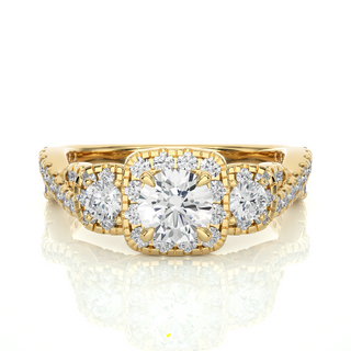 Front view of 2.50 Ct Round Moissanite Three Stone Halo Engagement Ring In Yellow Gold, highlighting the brilliant center Moissanite stone.