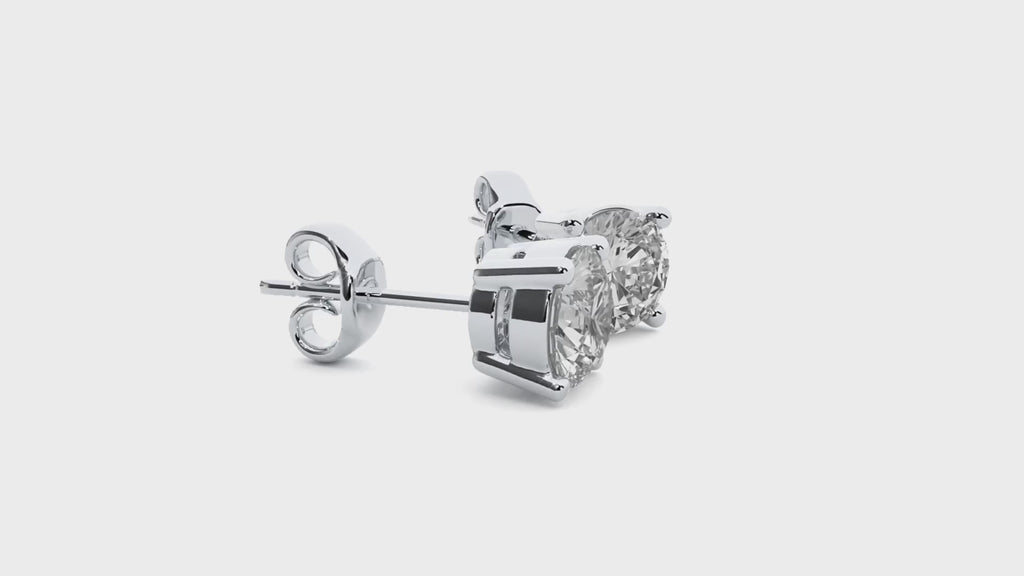 Video showing white gold moissanite earrings turning around to show all sides and sparkle.
