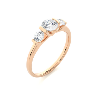 Angled view of 2 Carat Round Cut Moissanite Three Stone Engagement Ring In Rose Gold, showcasing the band and setting.​