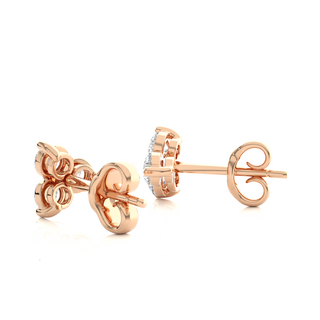 Angle View of 2 Carat Round Cut Moissanite Three Stone Stud Earrings In Rose Gold, showing shine and prong setting.