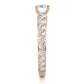 Side profile of 2 Ct Bridge Set Moissanite Engagement Ring With Accent In Rose Gold, highlighting the prong setting.