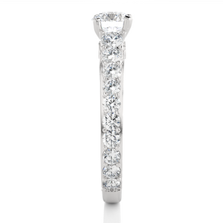 Side profile of 2 Ct Bridge Set Moissanite Engagement Ring With Accent In Silver, highlighting the prong setting.