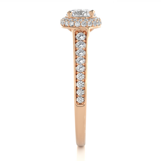 Side profile of 2 Ct Round Cut Moissanite Halo Engagement Ring In Rose Gold, highlighting the brilliant center moissanite stone., highlighting the prong setting.