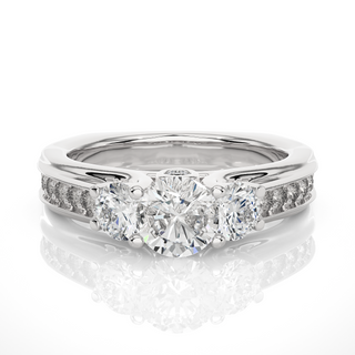 Front view of 2 Ct Round Moissanite Three Stone Engagement Ring In White Gold, highlighting the brilliant center Moissanite stone.