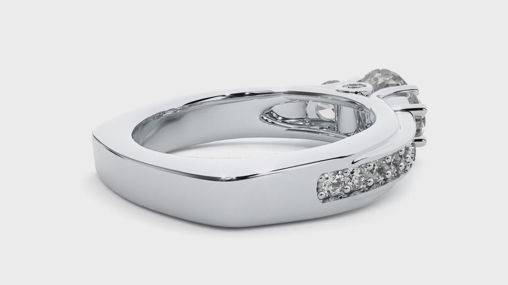 White gold three-stone moissanite engagement ring video, showcasing its brilliance and elegant design from multiple angles.